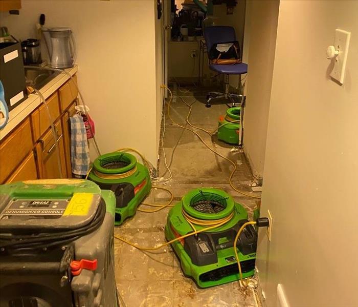 Flooded basement with water mitigation equipment 