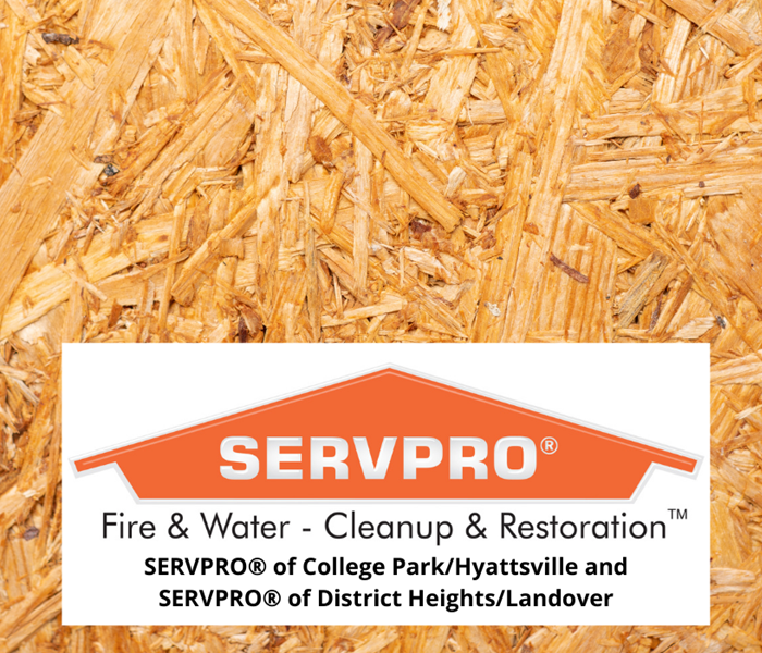 Board of plywood with SERVPRO orange logo